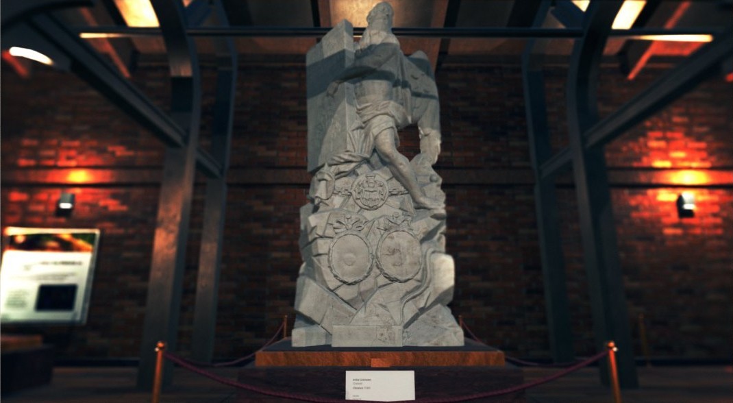The marble sleeping statue, dramatically lit against the brick wall with its object label in front